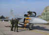 The pilots were welcomed at their planes.